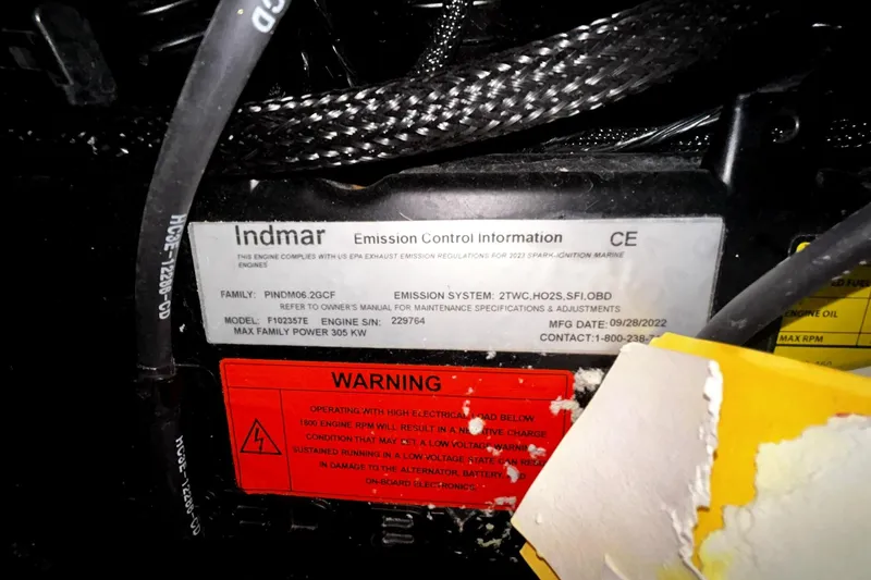 Slide: The Image of Indmar emission control label on 2023 Supra SA 450 engine, highlighting specifications and warnings. - 7