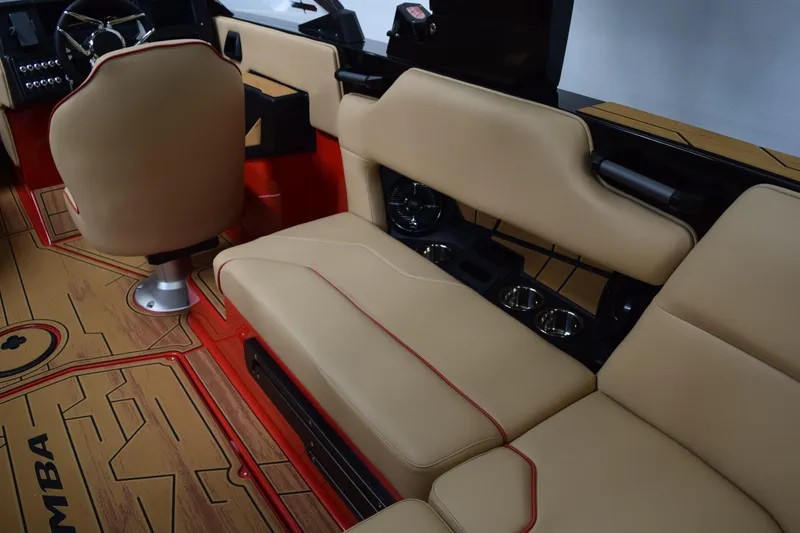 Slide: The Image of 2026 Moomba Max boat interior with beige seating and red accents. - 13