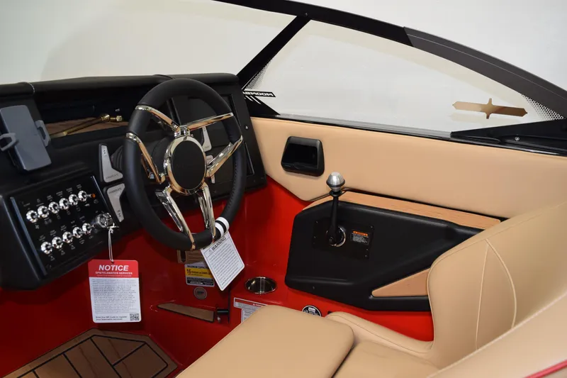Slide: The Image of 2026 Moomba Max boat interior with sleek steering wheel and modern dashboard controls. - 14