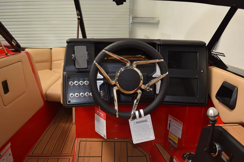 Slide: The Image of 2026 Moomba Max boat interior with steering wheel and control panel. - 15