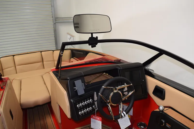 Slide: The Image of 2026 Moomba Max boat interior with beige seating and modern dashboard design. - 16