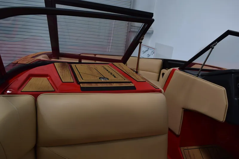 Slide: The Image of 2026 Moomba Max boat interior with beige seats and red accents. - 17
