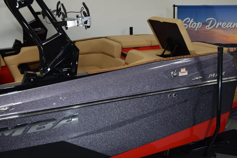 Slide: The Image of 2026 Moomba Max boat with sleek design and luxurious interior seating. - 2