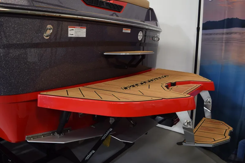 Slide: The Image of 2026 Moomba Max boat with red swim platform and teak accents. - 7