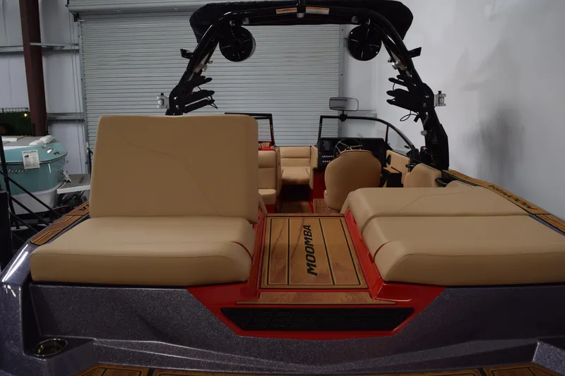 Slide: The Image of 2026 Moomba Max boat interior with beige seating and sleek design. - 8