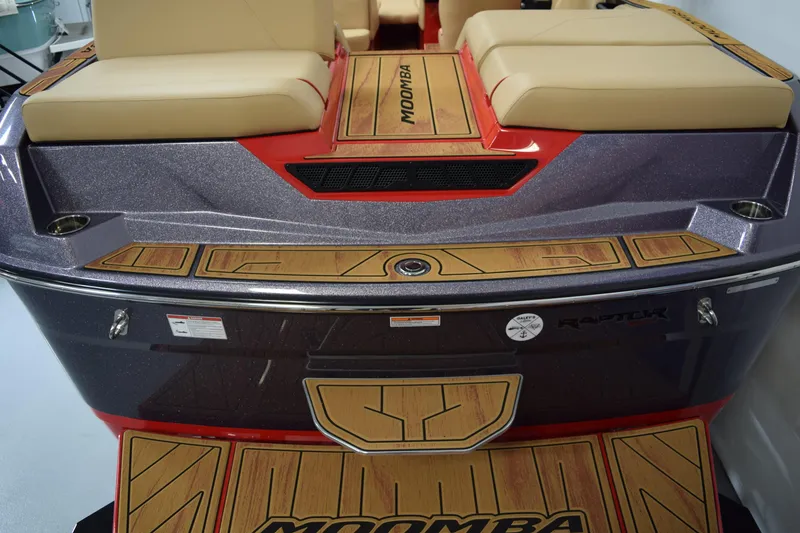 Slide: The Image of 2026 Moomba Max boat with cushioned seating and stylish wood accents. - 9