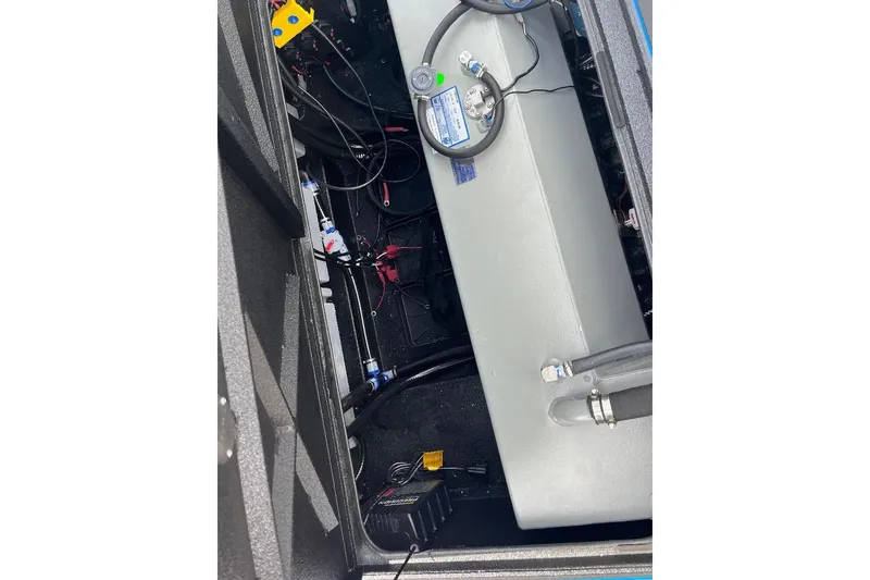 Slide: The Image of 2026 Xpress XR21 Bass boat interior showing wiring and components. - 8