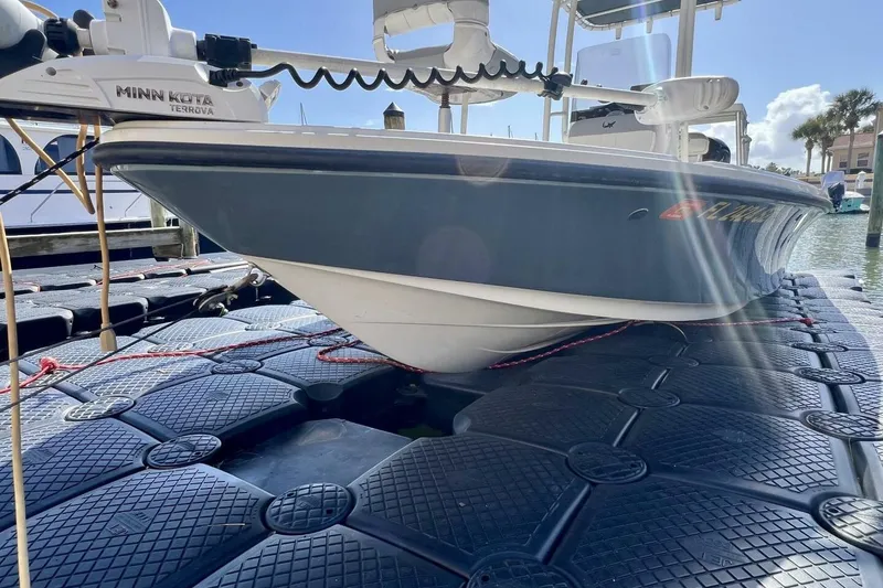 Slide: The Image of 2021 Mako 21 LTS boat on floating dock with Minn Kota Terrova motor. - 11