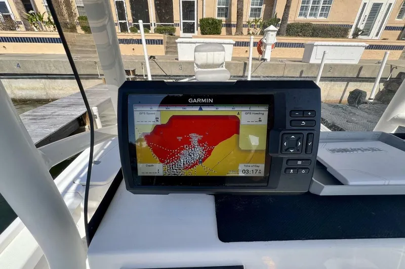 Slide: The Image of Garmin GPS on 2021 Mako 21 LTS boat, displaying navigation map and data. - 37