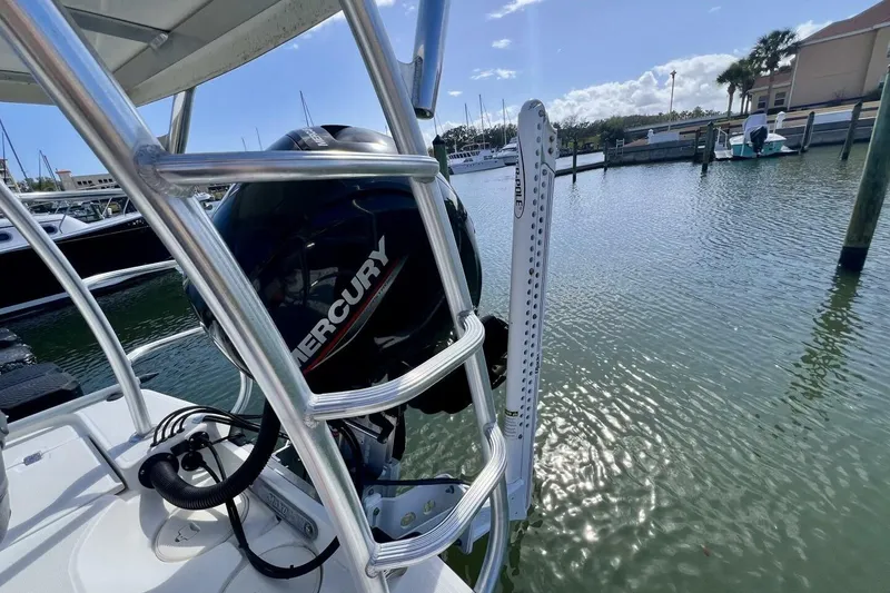 Slide: The Image of 2021 Mako 21 LTS boat with Mercury engine docked in marina. - 47