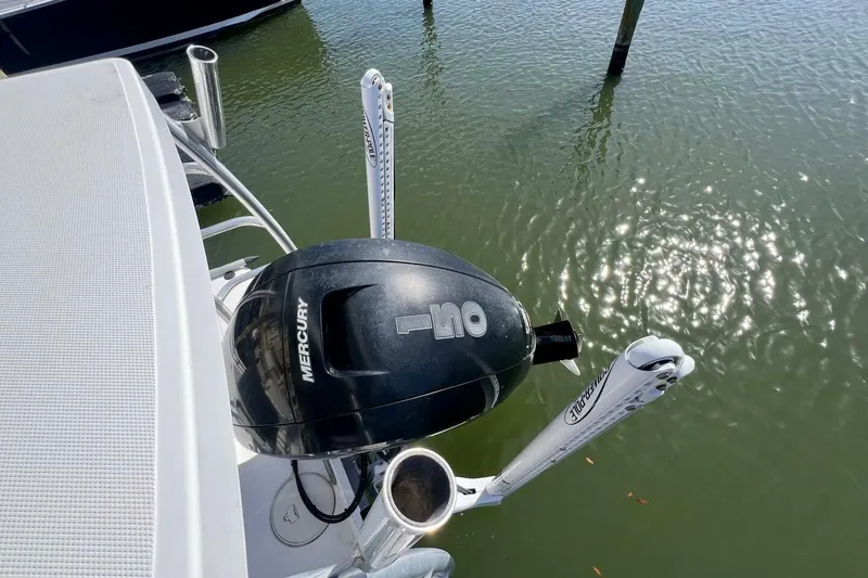 Slide: The Image of 2021 Mako 21 LTS boat with Mercury outboard motor on calm water. - 51