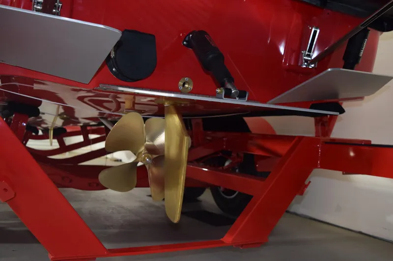 Slide: The Image of 2026 Moomba Craz boat underside with propeller and red trailer. - 21