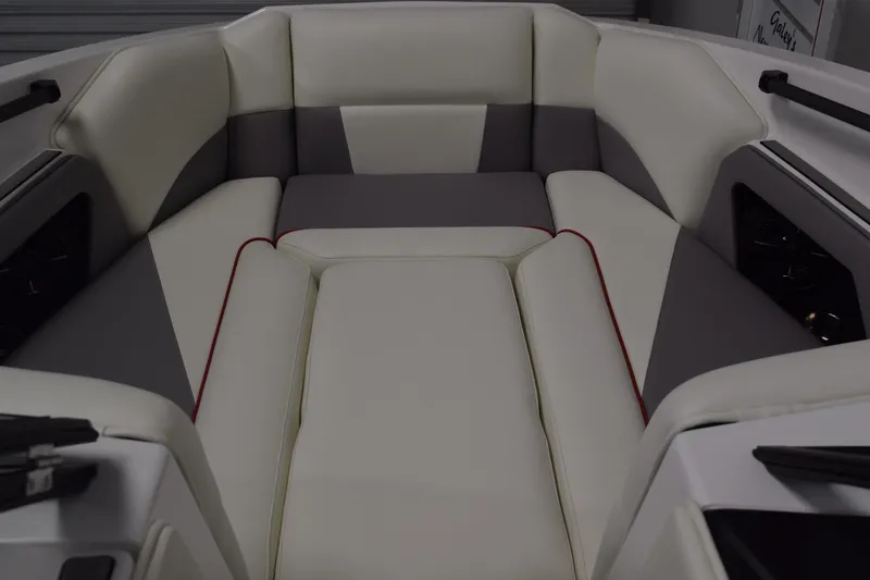 Slide: The Image of 2026 Moomba Craz boat interior with white and gray cushioned seating. - 28