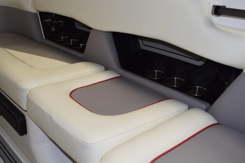 Slide: The Image of 2026 Moomba Craz interior seating with cup holders, featuring white and gray upholstery. - 30