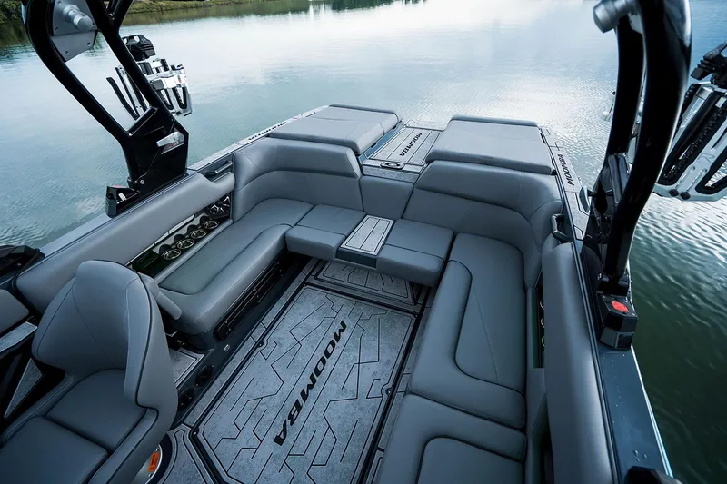 Slide: The Image of Manufacturer Provided Image: 2026 Moomba Craz boat interior with sleek gray seating and modern design on calm water. - 40