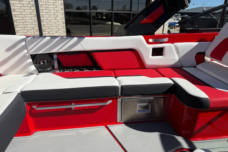 Slide: The Image of 2022 MasterCraft X26 boat interior with red and white seating, modern design. - 14