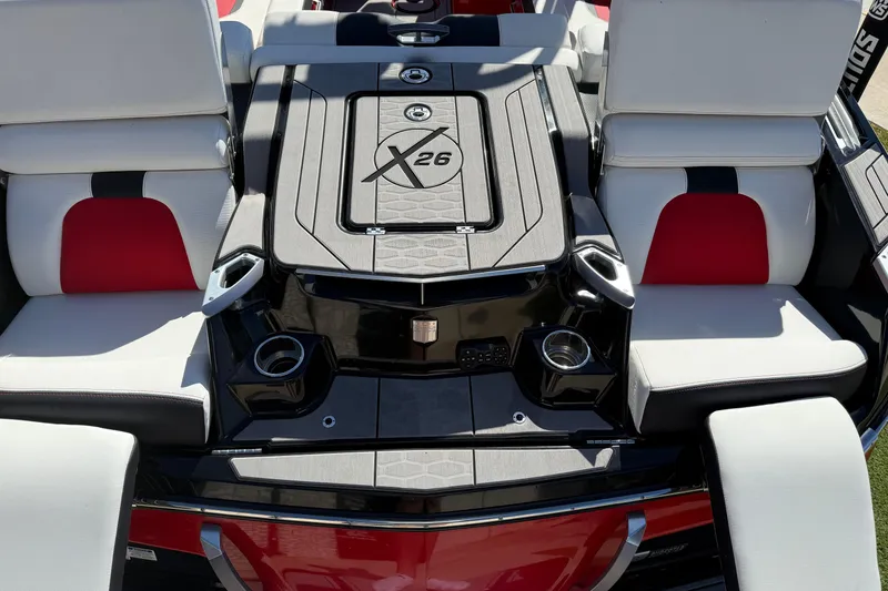 Slide: The Image of 2022 MasterCraft X26 boat interior with stylish seating and cup holders. - 18