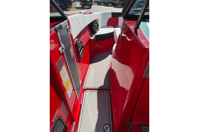 Slide: The Image of 2022 MasterCraft X26 boat interior with red and white seating, sleek design. - 7