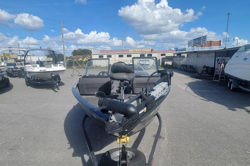 Slide: The Image of 2022 Tracker Pro Guide V-175 Combo boat displayed outdoors under a clear blue sky. - 6