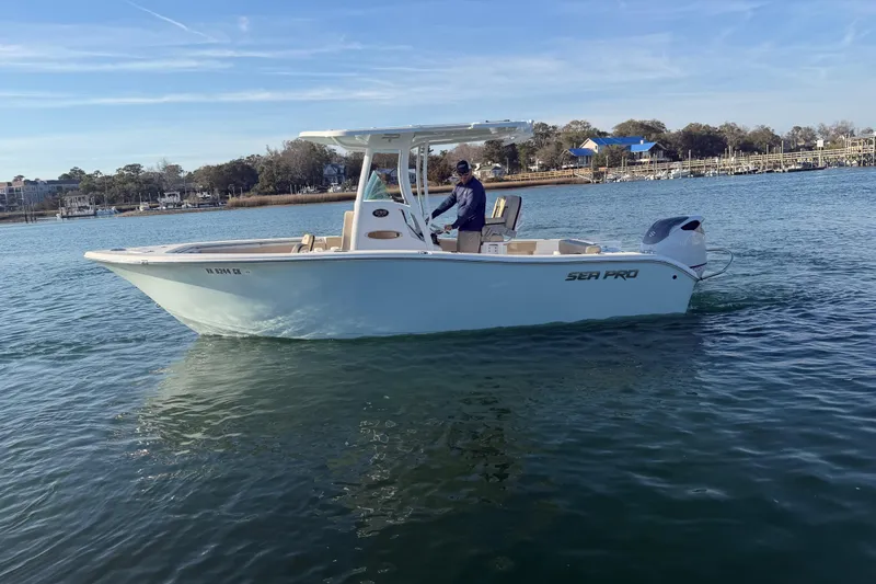 Slide: The Image of 2023 Sea Pro 239 Center Console boat cruising on calm water. - 21