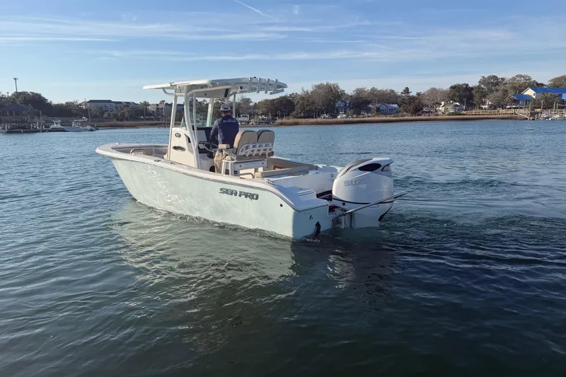 Slide: The Image of 2023 Sea Pro 239 Center Console boat cruising on calm waters. - 22