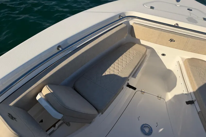 Slide: The Image of 2023 Sea Pro 239 Center Console boat interior with cushioned seating and elegant design. - 35