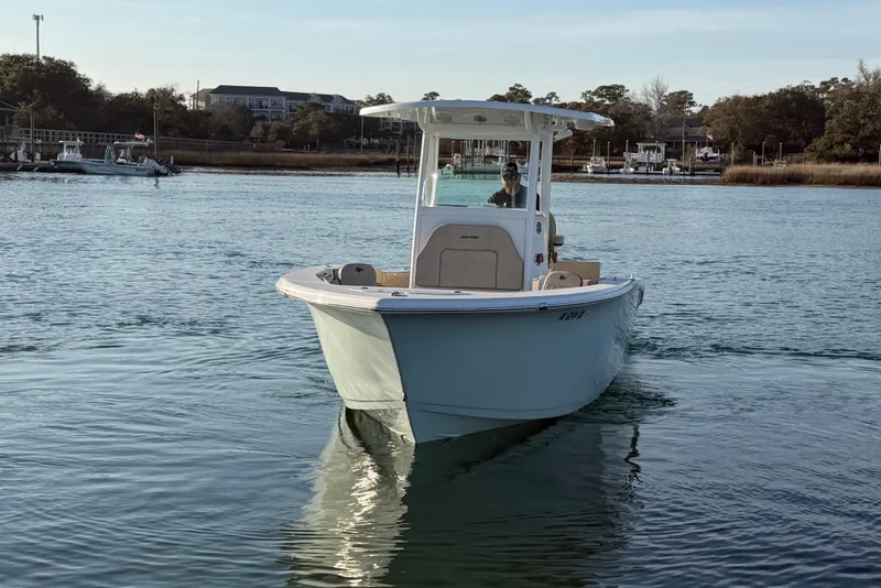 Slide: The Image of 2023 Sea Pro 239 Center Console boat on calm water, front view. - 4