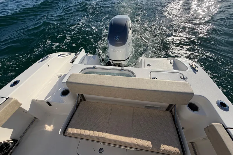 Slide: The Image of 2023 Sea Pro 239 Center Console boat with outboard motor on open water. - 46