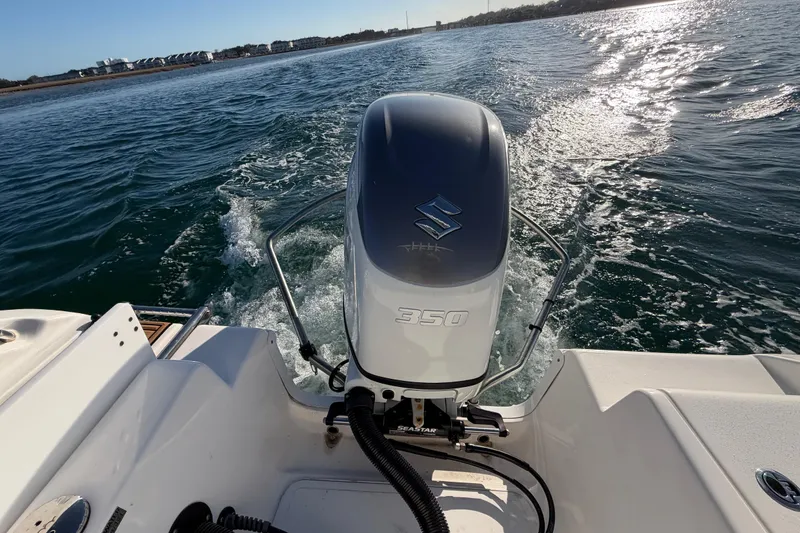 Slide: The Image of 2023 Sea Pro 239 Center Console boat with Suzuki 350 engine on open water. - 47