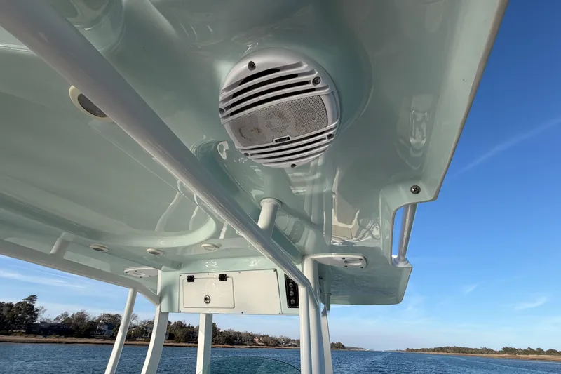 Slide: The Image of 2023 Sea Pro 239 Center Console boat with speaker, cruising on a sunny day. - 56