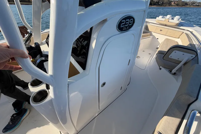 Slide: The Image of 2023 Sea Pro 239 Center Console boat interior with seating and console details. - 58