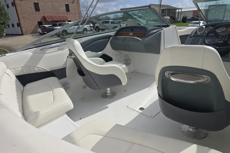Slide: The Image of Interior of a 2007 Cobalt 212 boat with white seating and dashboard. - 5