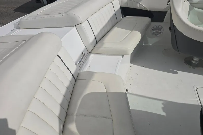 Slide: The Image of 2007 Cobalt 212 boat interior with white leather seating and clean design. - 7