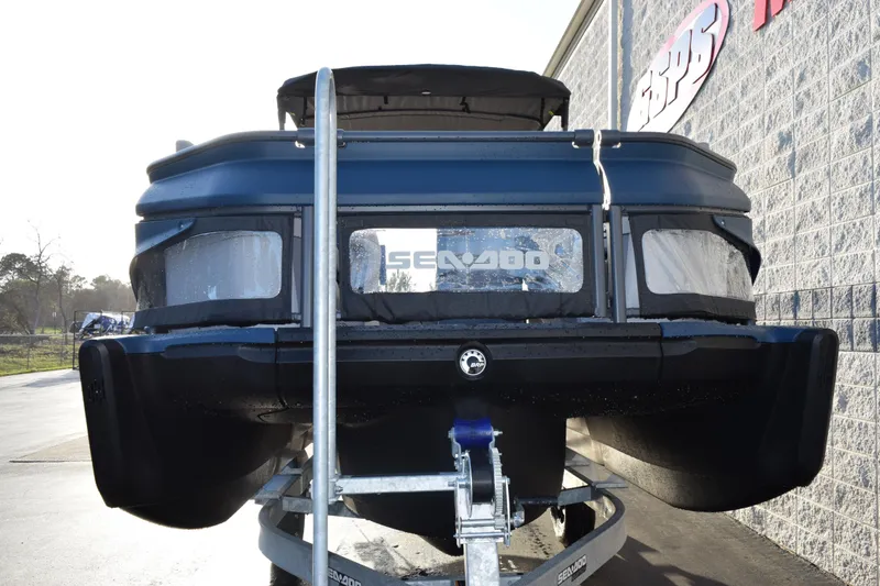 Slide: The Image of 2026 Sea-Doo Switch Cruise Limited 21 on trailer, rear view, parked outdoors. - 3
