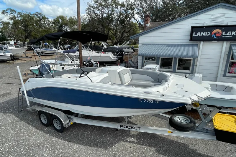 The Image of 2022 NauticStar 223 DC boat on trailer at Land Lake Marine dealership. - 0