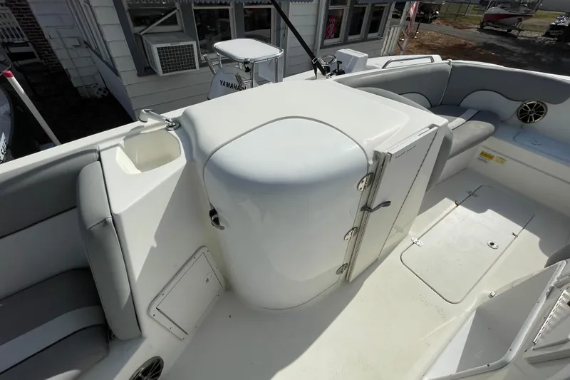 Slide: The Image of 2022 NauticStar 223 DC boat interior with seating and storage compartments. - 4