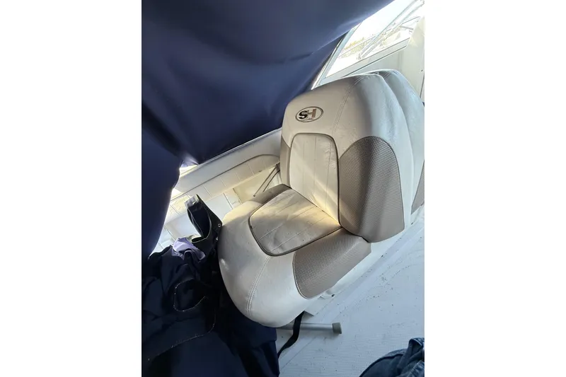 Slide: The Image of Boat seat in a 2011 Sea Hunt Escape 220 LE, featuring a cushioned design. - 10