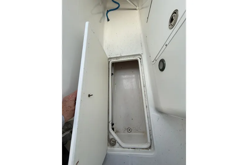 Slide: The Image of Open storage compartment on 2011 Sea Hunt Escape 220 LE boat. - 17