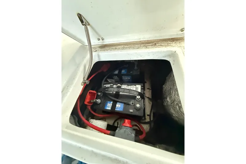 Slide: The Image of Battery compartment of a 2011 Sea Hunt Escape 220 LE boat. - 20