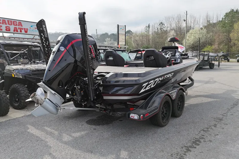Slide: The Image of 2025 Nitro Z20 XL Pro boat with powerful outboard motor in a dealership lot. - 1