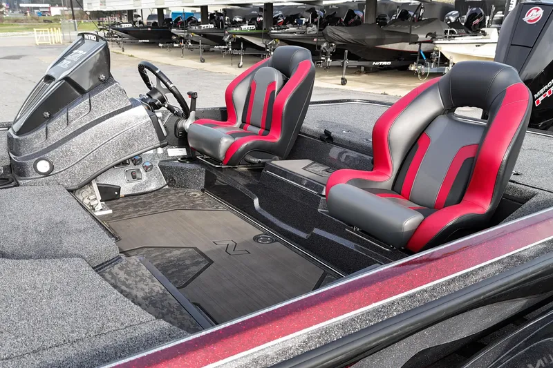 Slide: The Image of 2025 Nitro Z20 XL Pro boat interior with red and gray seats, sleek design. - 7