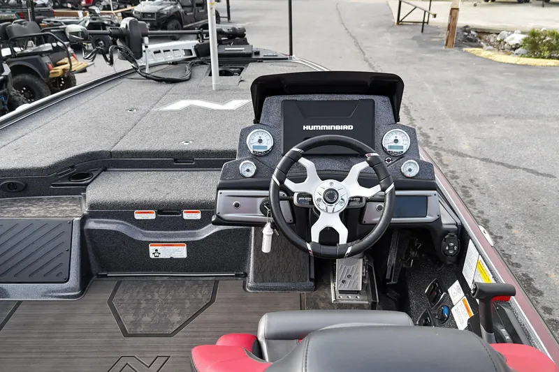 Slide: The Image of 2025 Nitro Z20 XL Pro boat cockpit with steering wheel and Humminbird display. - 9