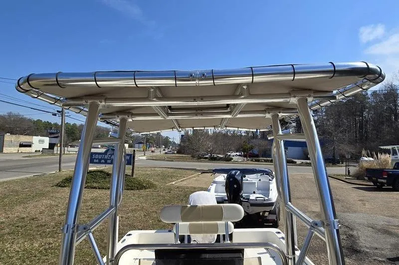 The Image of 2022 Bulls Bay 2200 boat with T-top, parked outdoors on a sunny day. - 1
