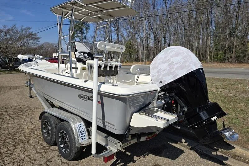 Slide: The Image of 2022 Bulls Bay 2200 boat on trailer, featuring a sleek design and powerful outboard motor. - 3