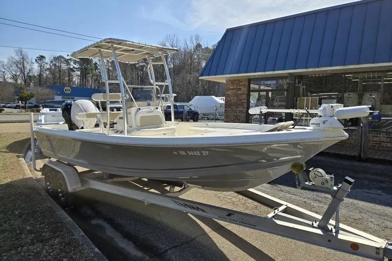 Slide: The Image of 2022 Bulls Bay 2200 boat on trailer outside a dealership. - 4
