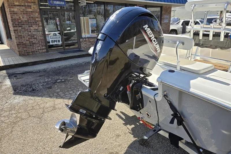 Slide: The Image of 2022 Bulls Bay 2200 boat with Mercury outboard motor, parked outside a Yamaha dealership. - 9