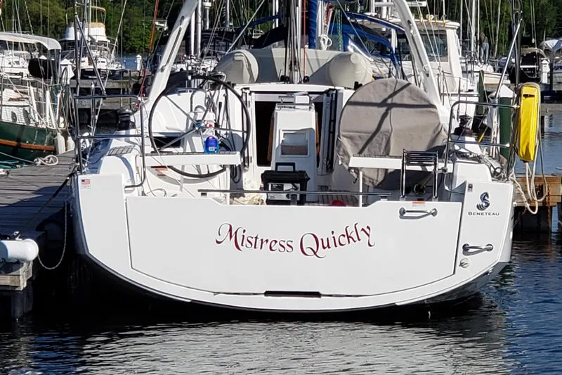 Slide: The Image of Beneteau Oceanis 35 sailboat, 2015 model, docked at marina with "Mistress Quickly" name. - 4
