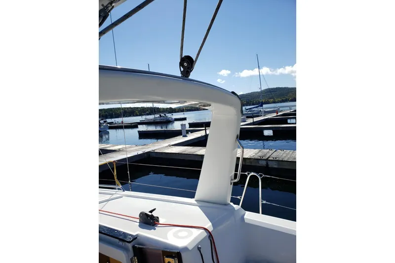 Slide: The Image of Beneteau Oceanis 35 sailboat docked at a marina, sunny day, 2015 model. - 7
