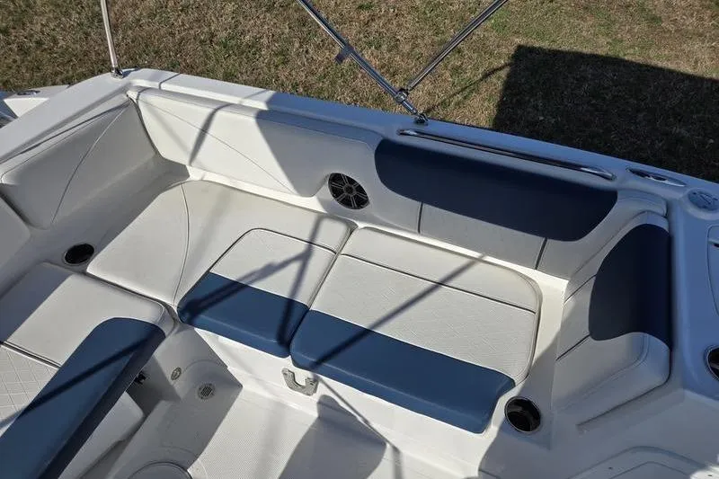 Slide: The Image of 2024 Tahoe 2150 boat interior with cushioned seating and speaker. - 5