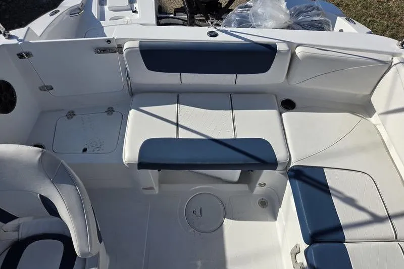 Slide: The Image of 2024 Tahoe 2150 boat interior with white and blue seating arrangement. - 6